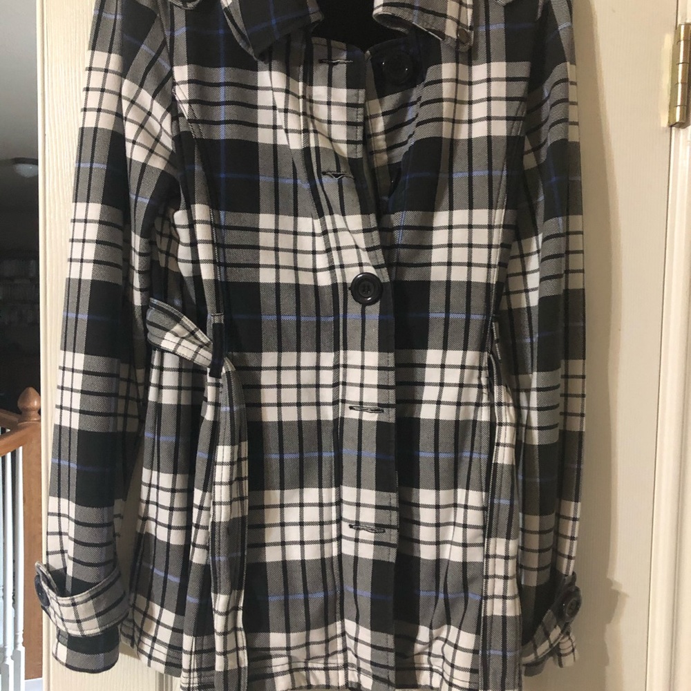 A jacket black, grey, white with a blue line